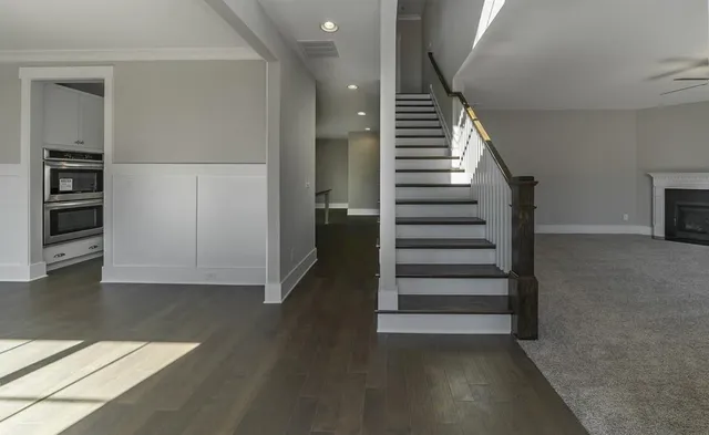 wooden floor in an empty room with a fireplace