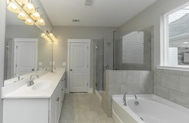 a bathroom with a bathtub and a sink
