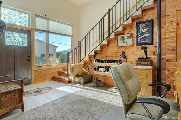 a room with furniture and stairs