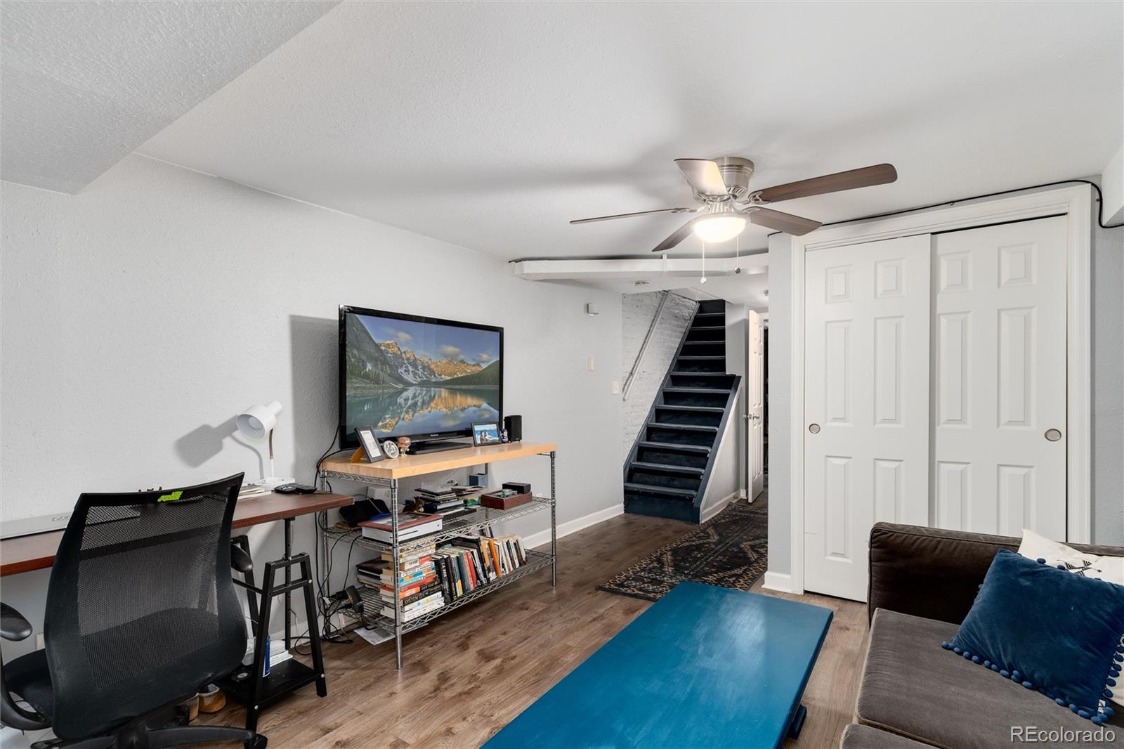 549 Logan Street Denver, CO 80203 - Photo 11 of 14 a living room with furniture and a wooden floor