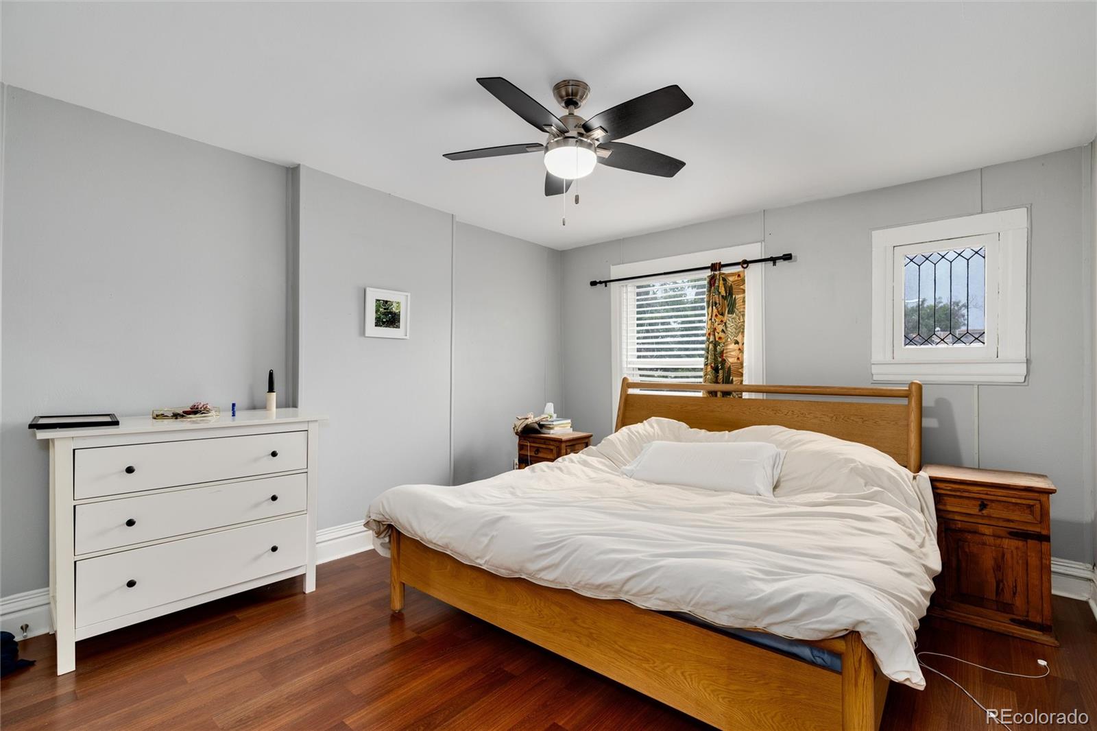 549 Logan Street Denver, CO 80203 - Photo 7 of 14 a bedroom with a bed and a window