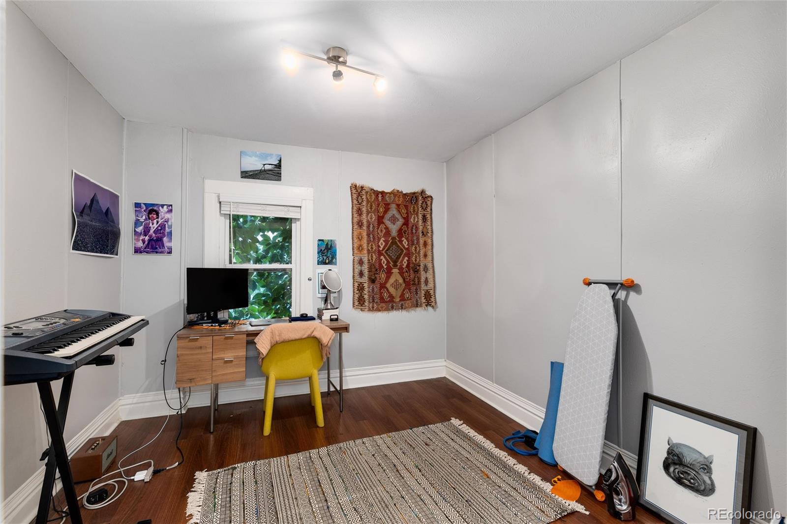 549 Logan Street Denver, CO 80203 - Photo 10 of 14 a workspace with furniture and wooden floor