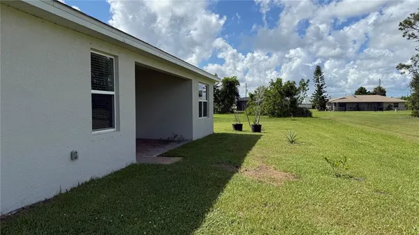 a backyard of a house with lots of green space