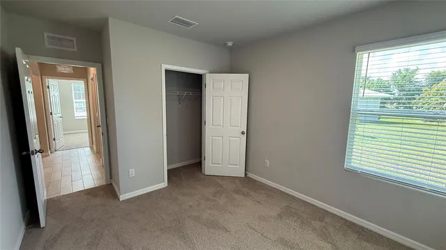 a view of empty room with windows