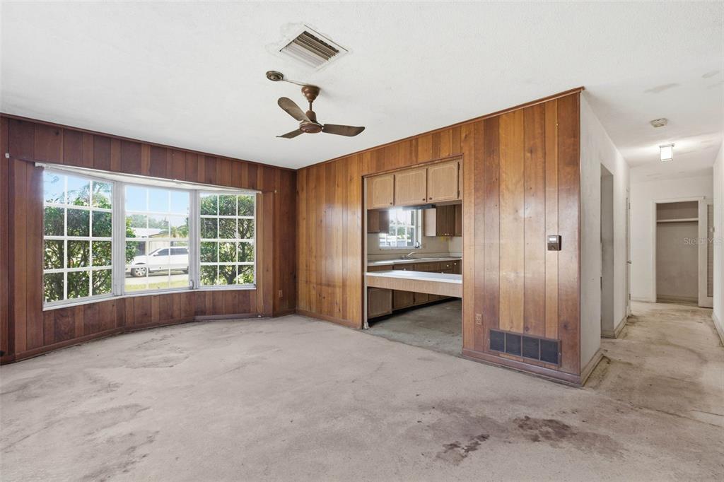 2310 Harrison Drive Dunedin, FL 34698 - Photo 17 of 42 a view of empty room with a fireplace and cabinet