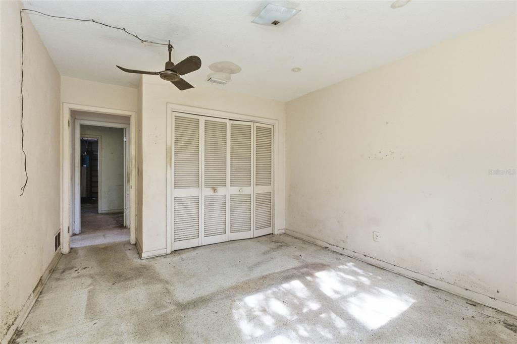 2310 Harrison Drive Dunedin, FL 34698 - Photo 24 of 42 an empty room with windows