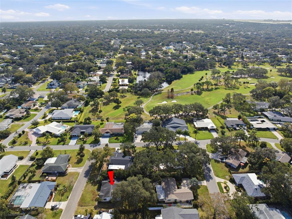 2310 Harrison Drive Dunedin, FL 34698 - Photo 36 of 42 an aerial view of residential houses with outdoor space