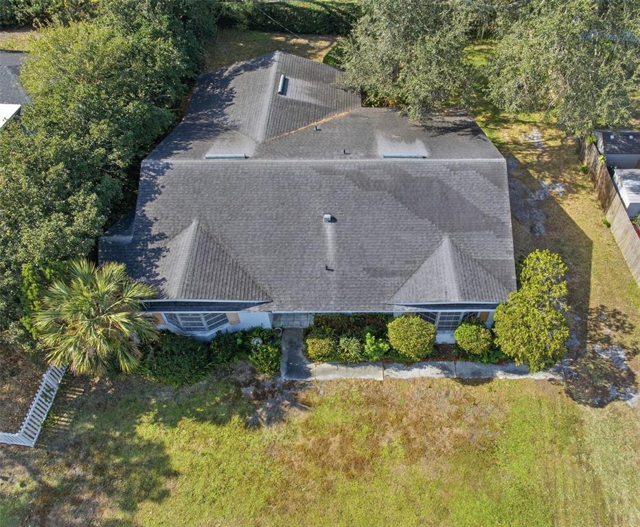 2310 Harrison Drive Dunedin, FL 34698 - Photo 42 of 42 an aerial view of a house with a yard