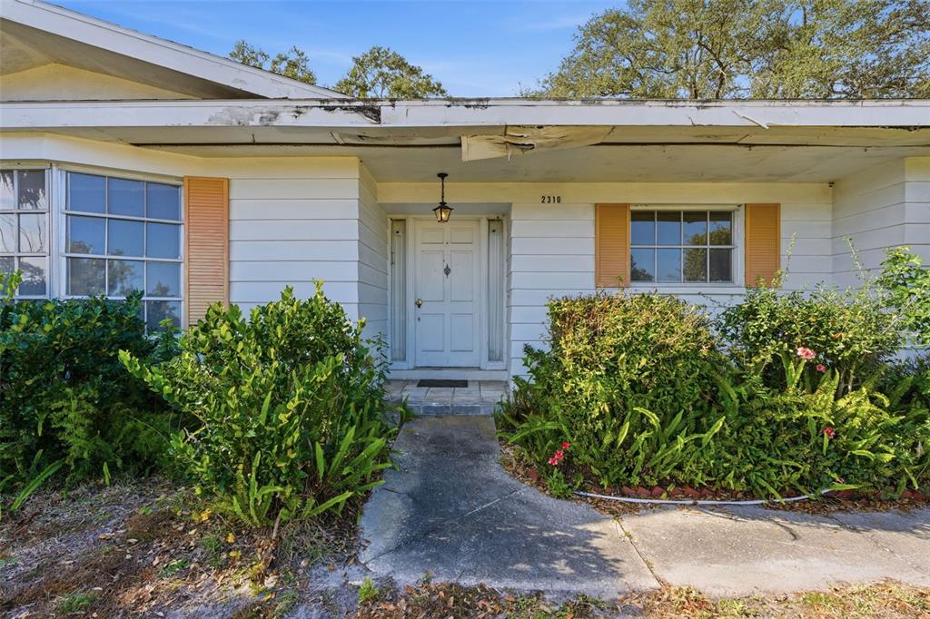 2310 Harrison Drive Dunedin, FL 34698 - Photo 8 of 42 front view of a house