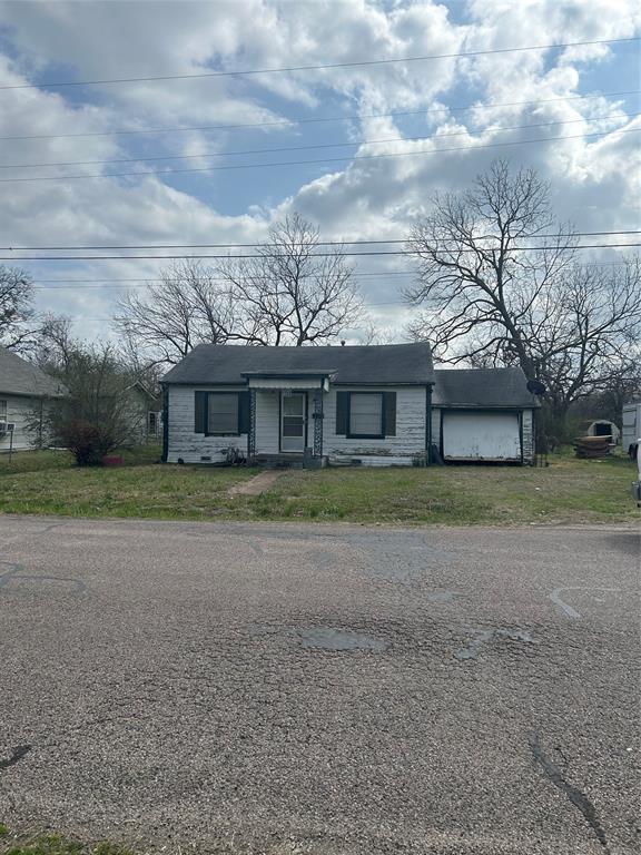 509 Allen Avenue Bonham, TX 75418 - Photo 1 of 9 Single story home with a front yard, covered porch, and a garage