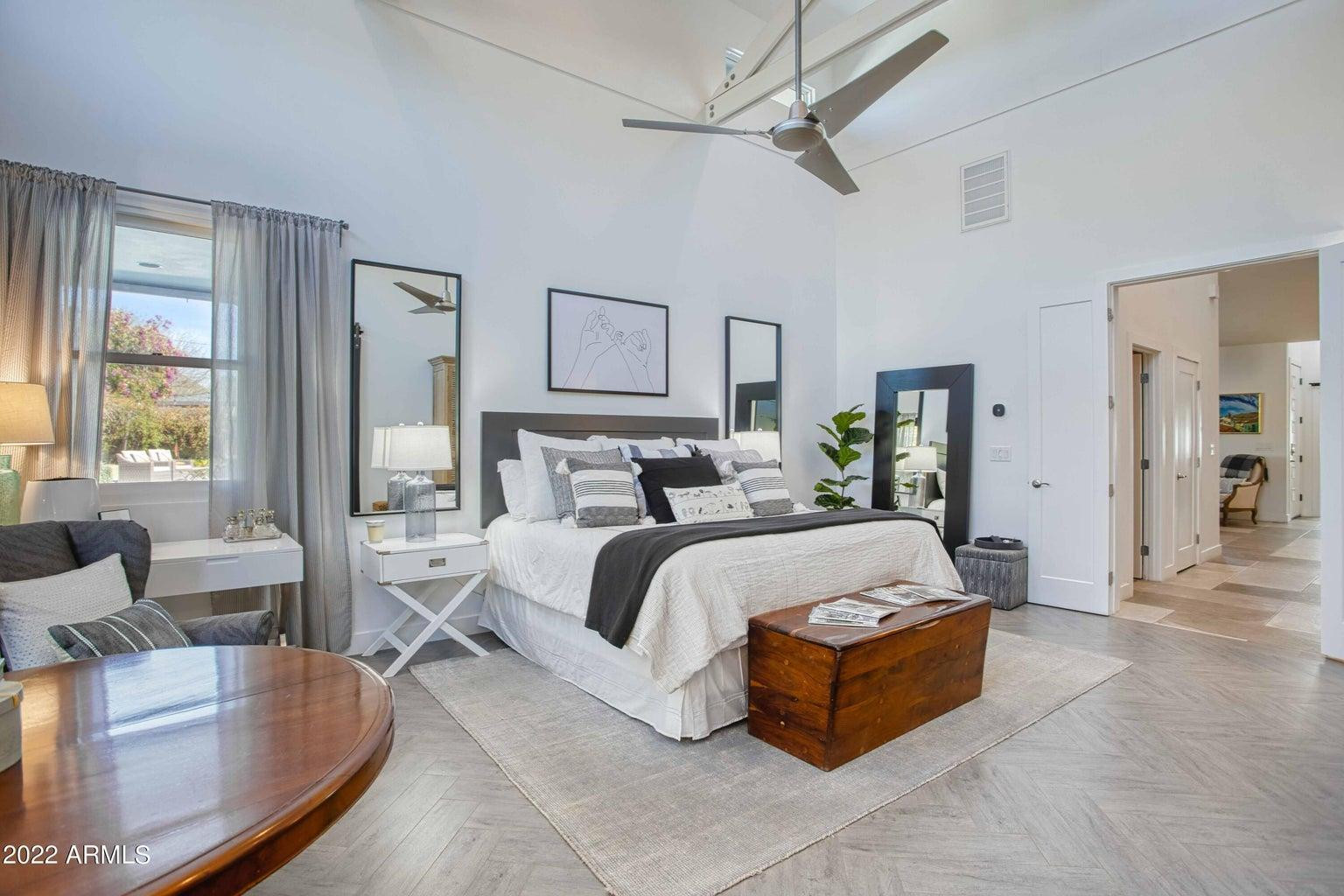 3230 East Colter Street Phoenix, AZ 85018 - Photo 14 of 28 a spacious bedroom with a bed couch and window