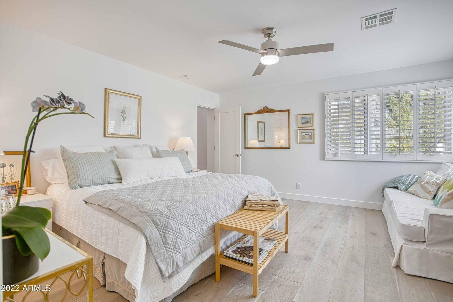 3230 East Colter Street Phoenix, AZ 85018 - Photo 17 of 28 a bed room with a bed and a couch