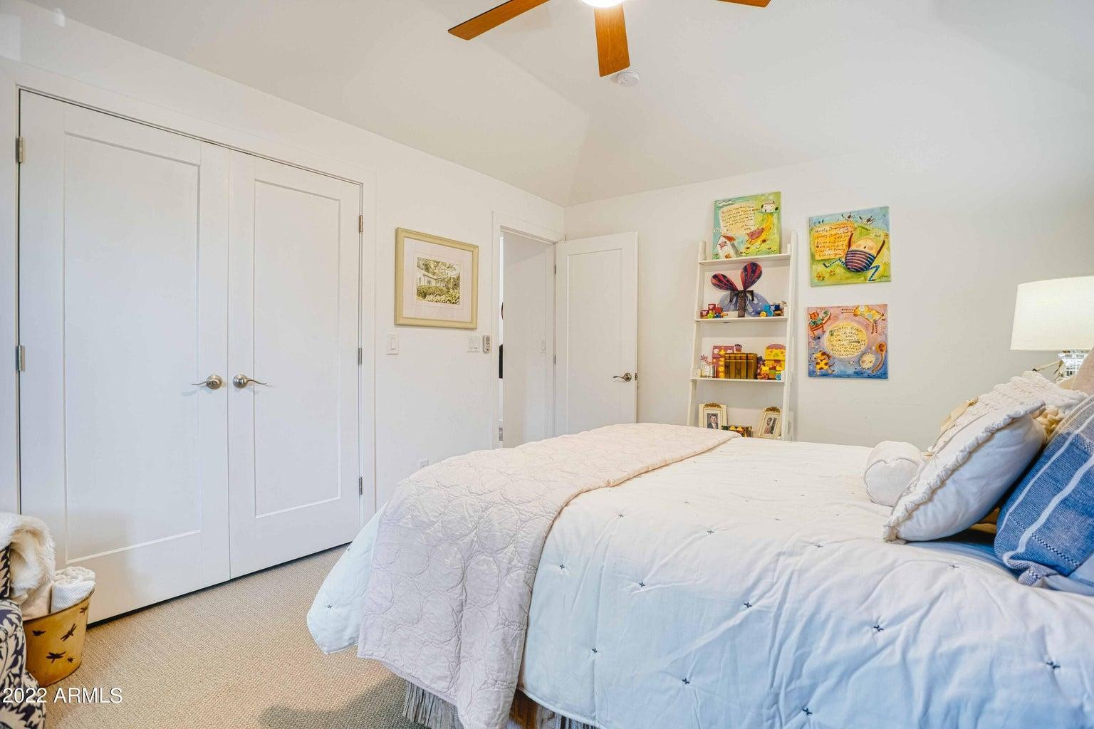 3230 East Colter Street Phoenix, AZ 85018 - Photo 20 of 28 a bedroom with a bed and a cabinets
