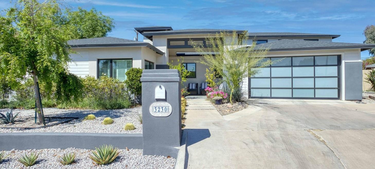 3230 East Colter Street Phoenix, AZ 85018 - Photo 2 of 28 a front view of a house with garden