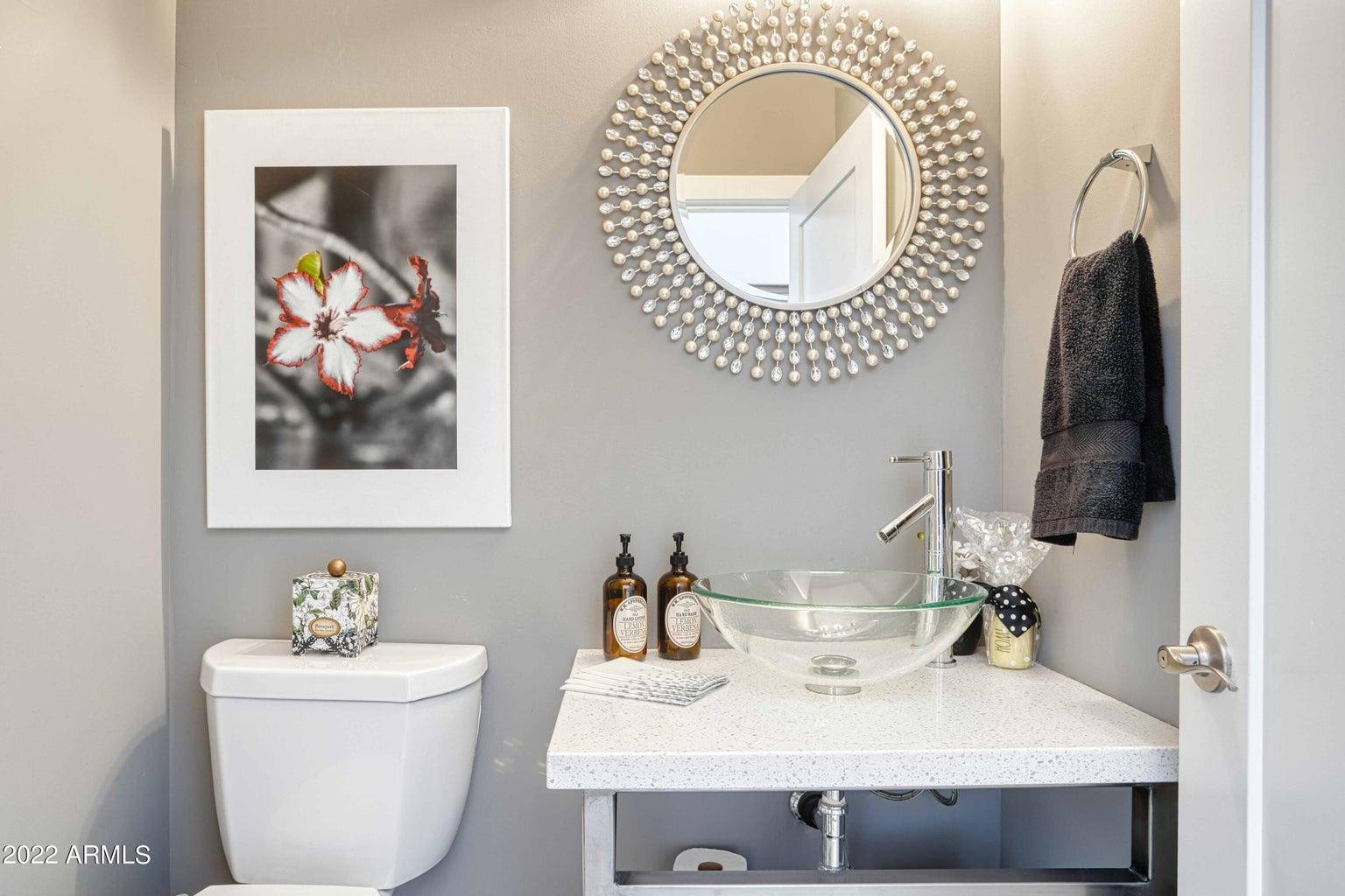3230 East Colter Street Phoenix, AZ 85018 - Photo 22 of 28 a bathroom with a sink and a mirror