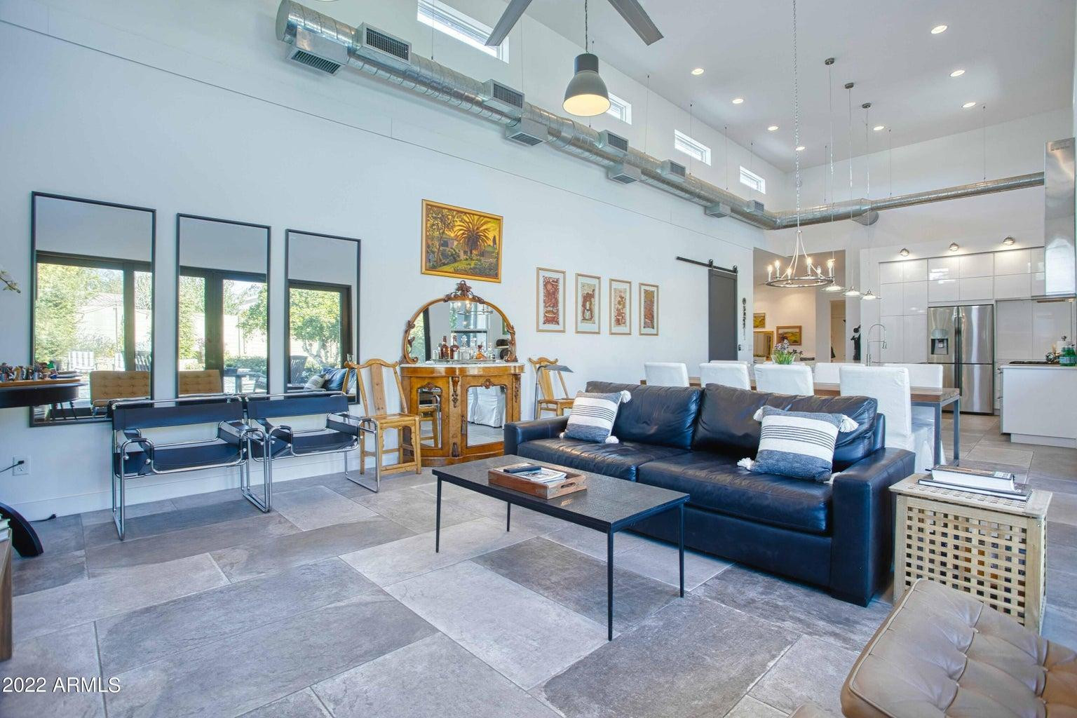 3230 East Colter Street Phoenix, AZ 85018 - Photo 8 of 28 a living room with furniture and a large window