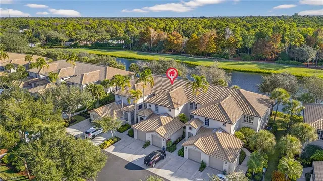 an aerial view of a house with a swimming pool