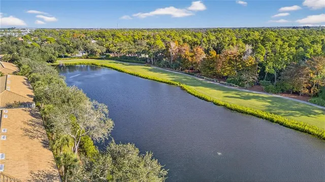 a view of a swimming pool and an outdoor seating