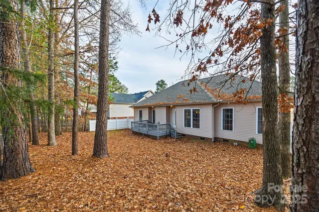 a house that has a tree in front of it