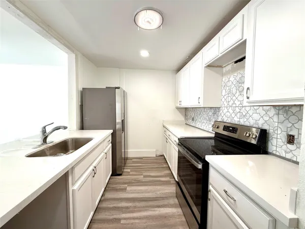 a view of a balcony with wooden fence