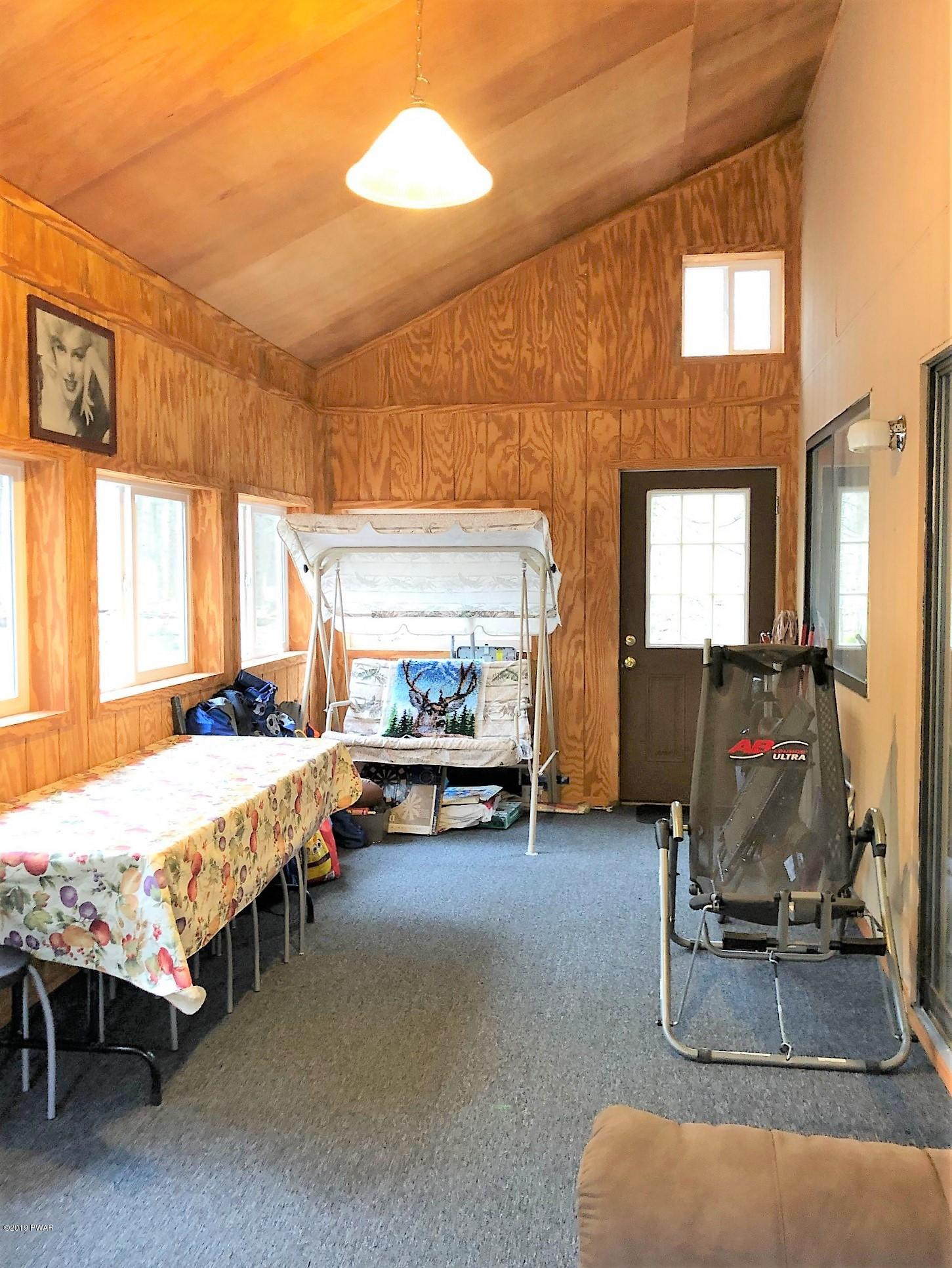 3039 Northgate Road Lake Ariel, PA 18436 - Photo 18 of 57 a room with gym equipment and a table