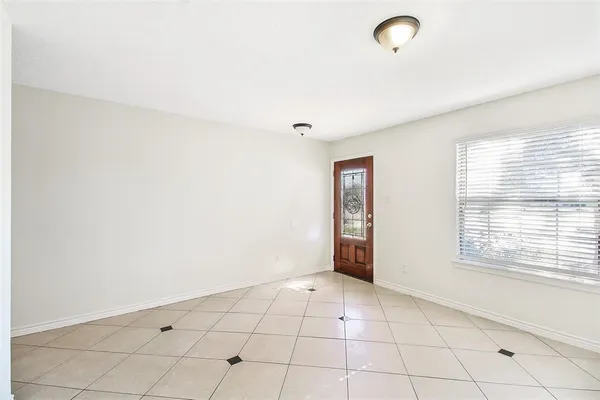 a view of an empty room with a window