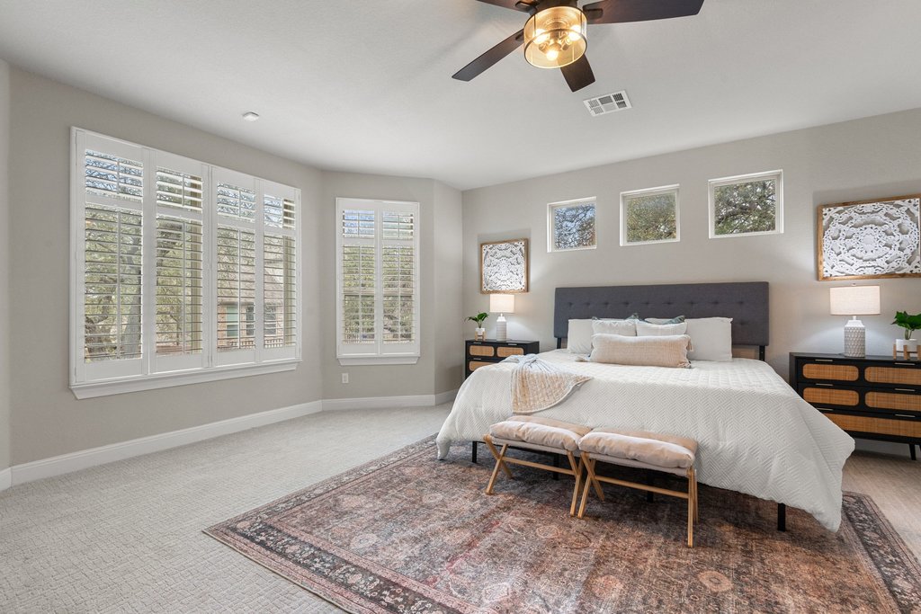 4229 Borho Ranch Street Leander, TX 78641 - Photo 14 of 40 Bedroom featuring a ceiling fan and carpet flooring