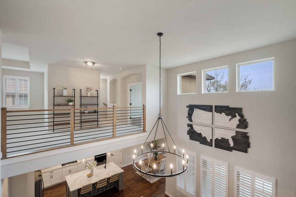 4229 Borho Ranch Street Leander, TX 78641 - Photo 21 of 40 Detailed view of wood finished floors and suspended lighting