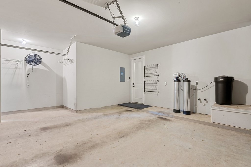 4229 Borho Ranch Street Leander, TX 78641 - Photo 30 of 40 Garage featuring electric panel and a garage door opener