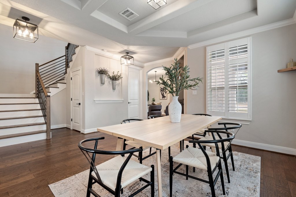 4229 Borho Ranch Street Leander, TX 78641 - Photo 7 of 40 Dining space featuring dark wood-style flooring and ornamental molding