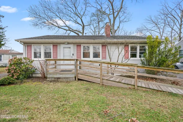 front view of a house with a small yard