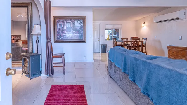 a living room with furniture and a rug