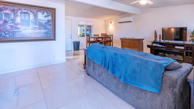 a bedroom with a bed and glass wall