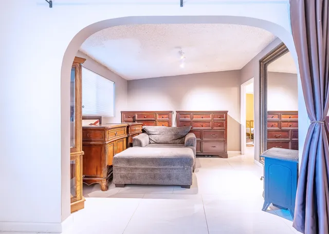 a kitchen with stainless steel appliances granite countertop a stove a sink dishwasher and a refrigerator