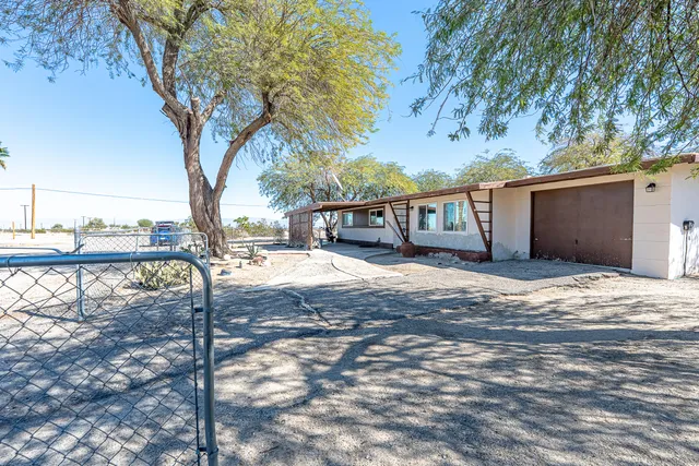 a view of a backyard of the house