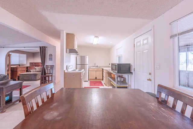 a view of staircase with furniture and a painting