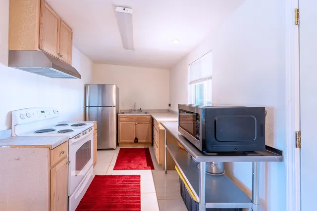 a bathroom with a sink a toilet and vanity