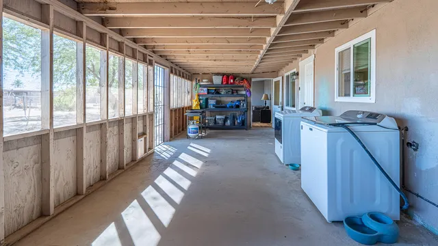 a view of house with backyard and a garden