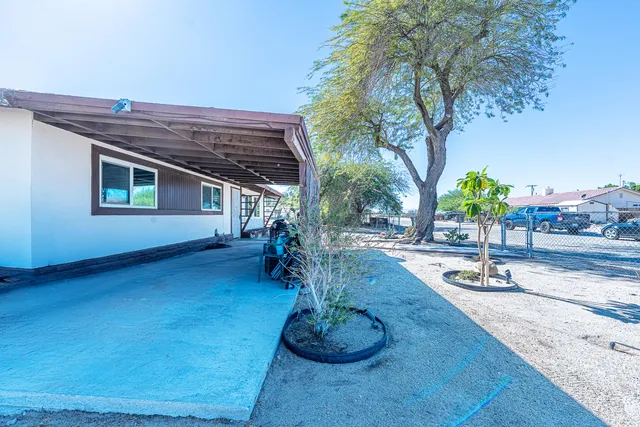 a swimming pool with outdoor seating