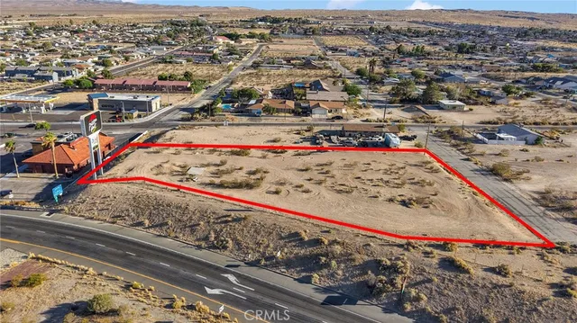 a view of a buildings with an small garden