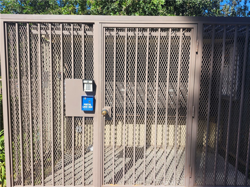 849 East Victoria Street, Unit 209 Carson, CA 90746 - Photo 4 of 5 a view of a wooden fence