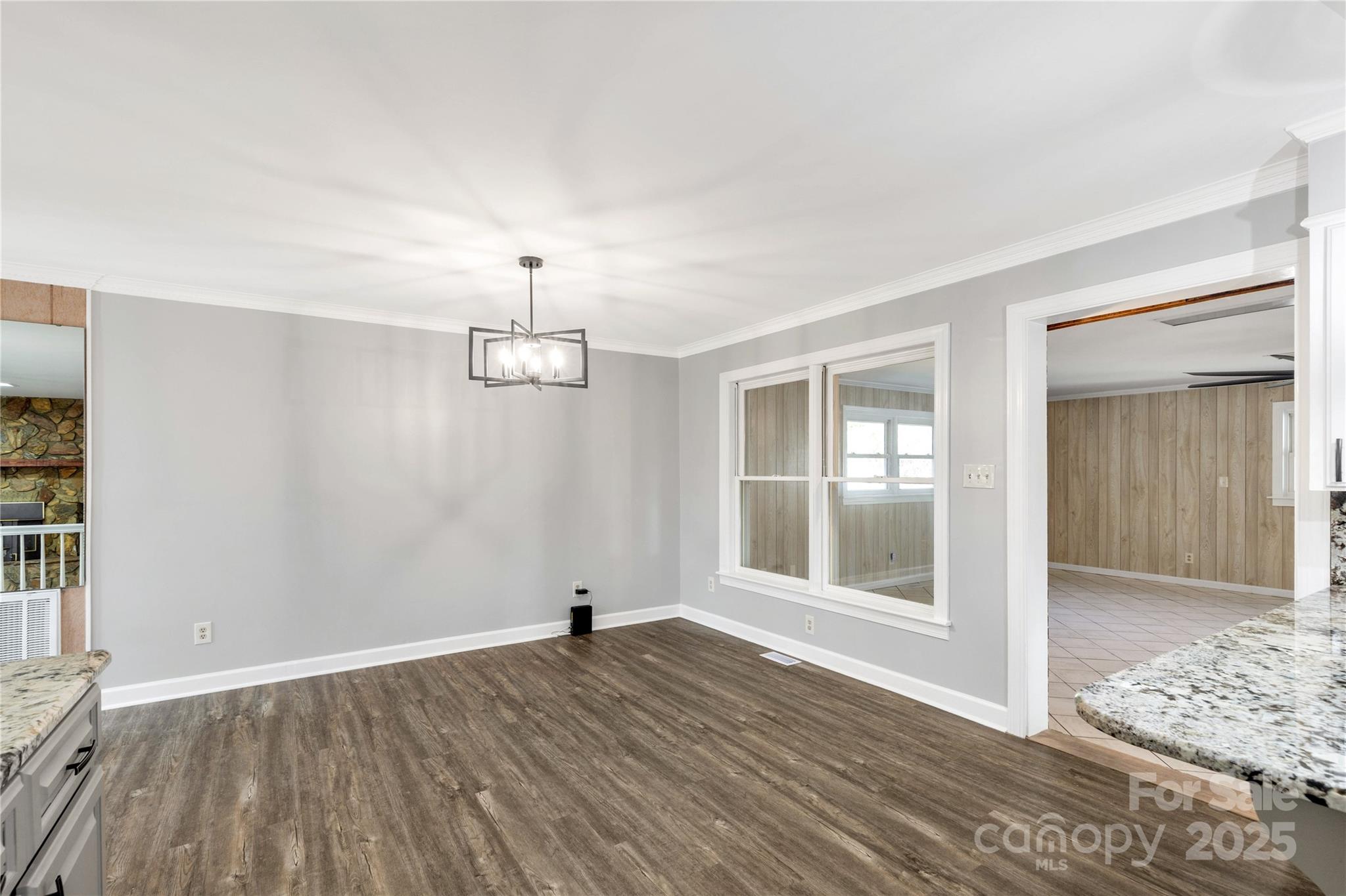 4336 McAllister Road Catawba, SC 29704 - Photo 14 of 47 an empty room with wooden floor cabinet and windows