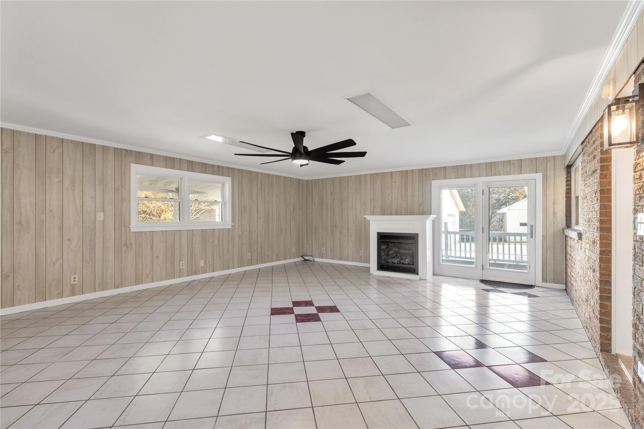 4336 McAllister Road Catawba, SC 29704 - Photo 17 of 47 an empty room with windows and fireplace