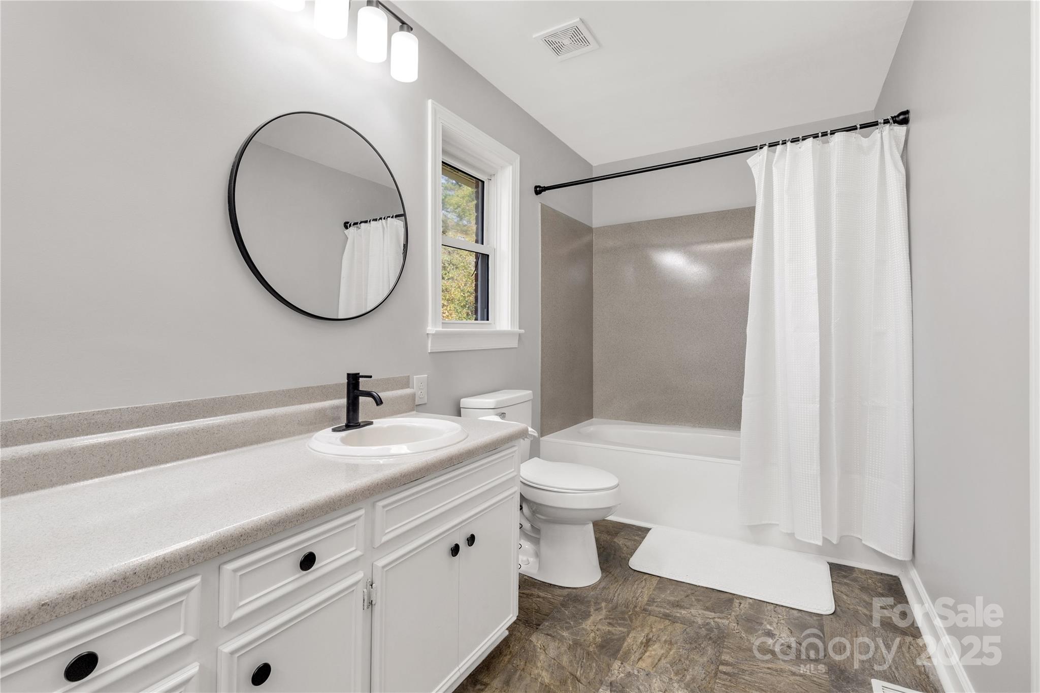 4336 McAllister Road Catawba, SC 29704 - Photo 22 of 47 a bathroom with a sink a toilet and a mirror