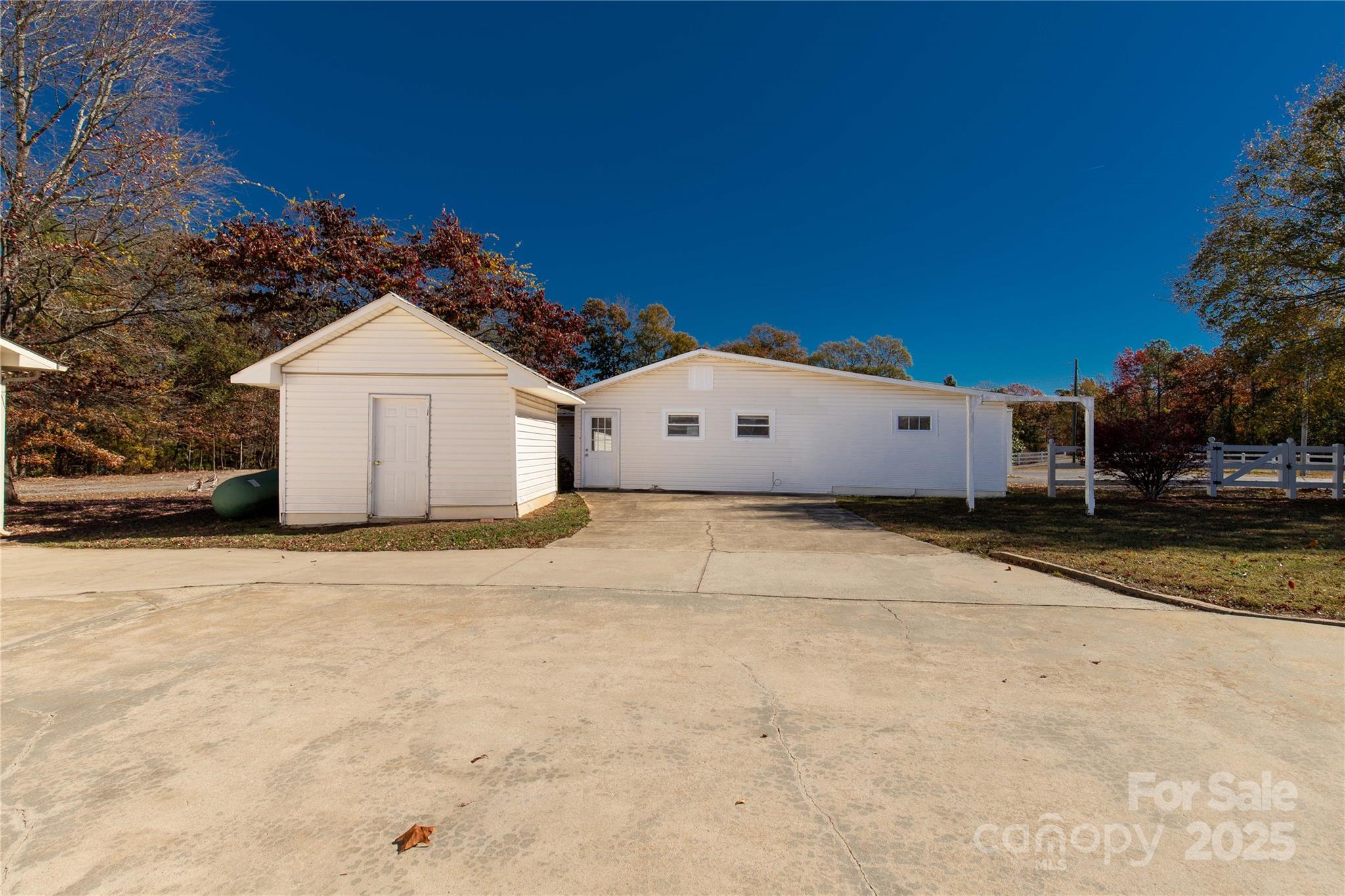 4336 McAllister Road Catawba, SC 29704 - Photo 32 of 47 a view of a white house with a yard