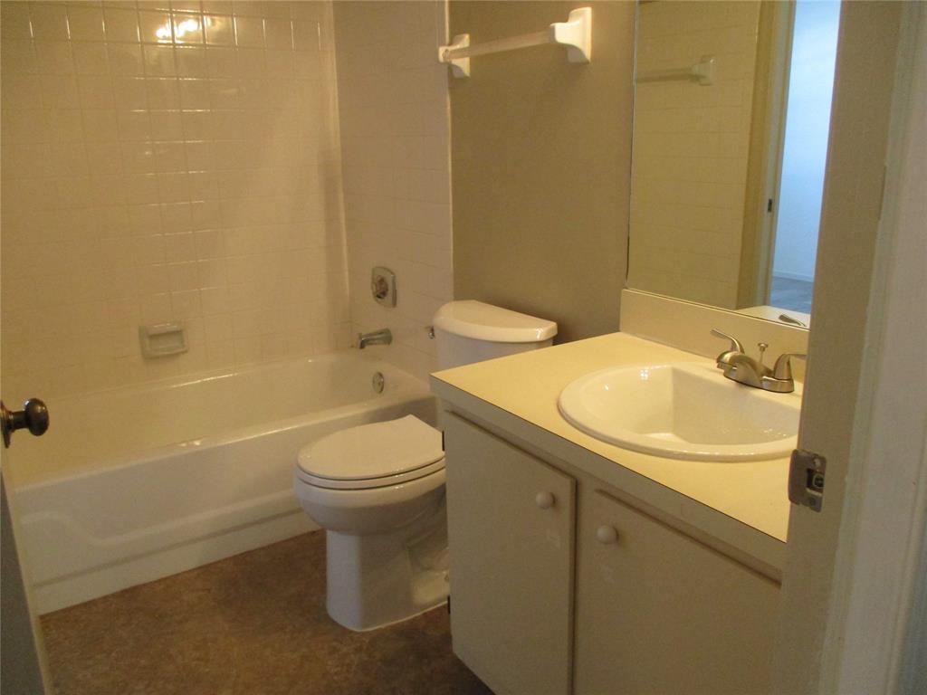 23442 Southwest 57th Avenue, Unit 406 Boca Raton, FL 33428 - Photo 12 of 25 a bathroom with a sink a toilet and shower