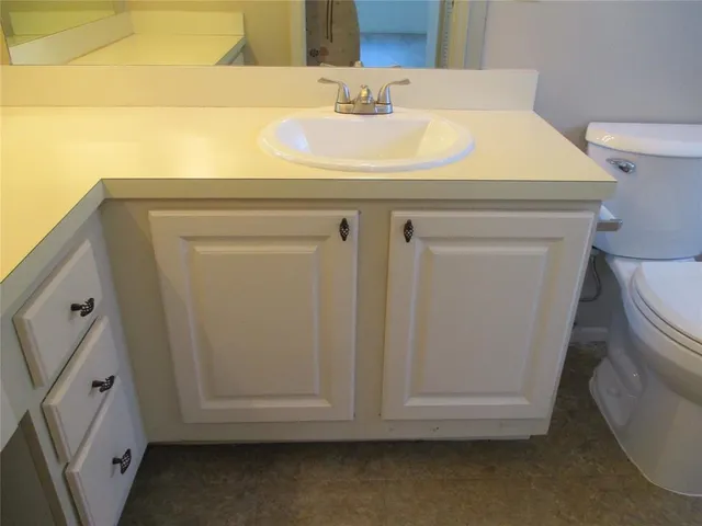 a bathroom with a sink and a vanity