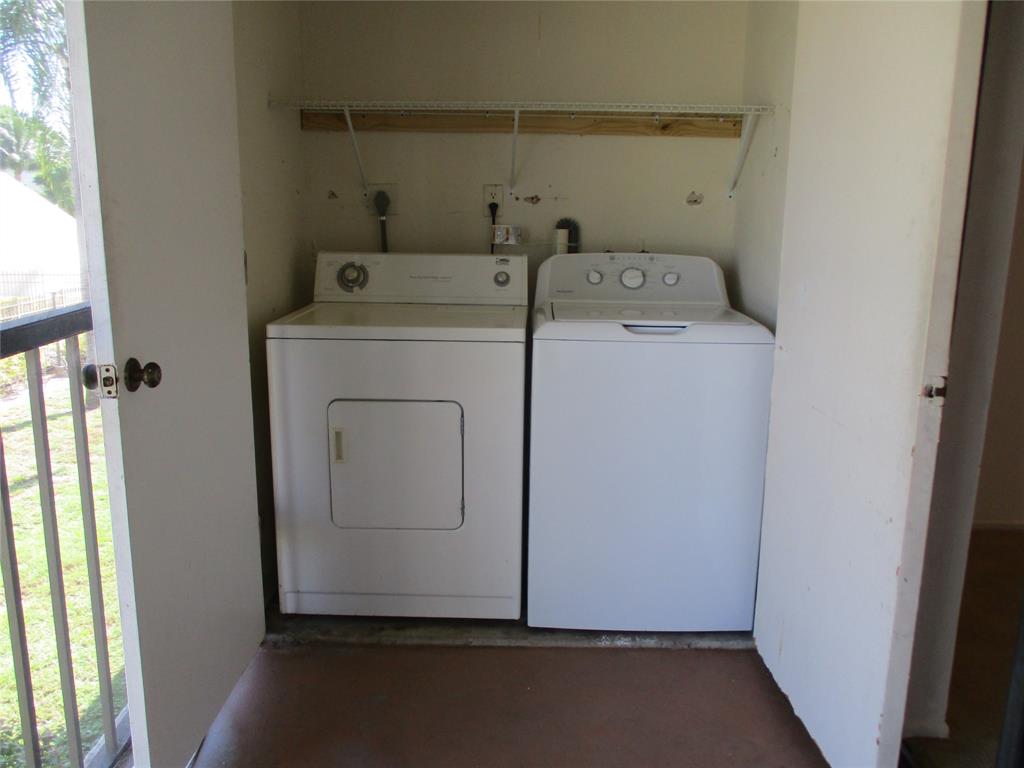 23442 Southwest 57th Avenue, Unit 406 Boca Raton, FL 33428 - Photo 20 of 25 a utility room with dryer and washer