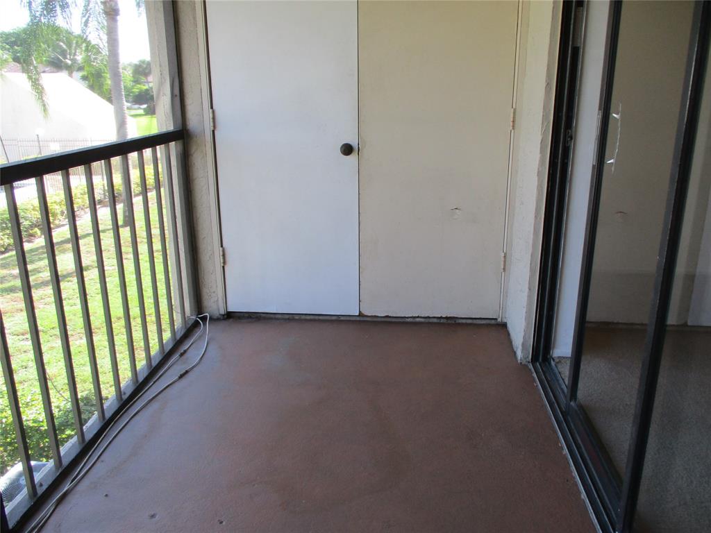 23442 Southwest 57th Avenue, Unit 406 Boca Raton, FL 33428 - Photo 21 of 25 a view of a hallway