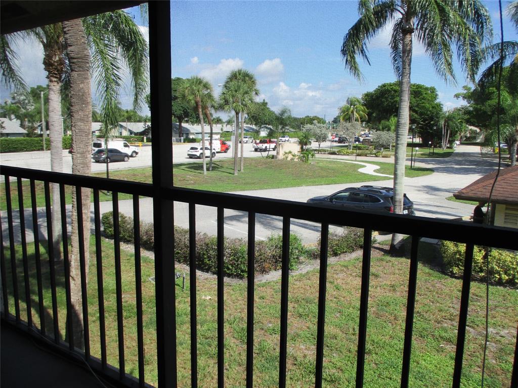 23442 Southwest 57th Avenue, Unit 406 Boca Raton, FL 33428 - Photo 22 of 25 a view of a street from a balcony